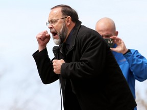 Pastor Henry Hildebrandt of Aylmer's Church of God speaks at an anti-lockdown protest at Tecumseh Park in Chatham on Monday, April 26, 2021. Mark Malone/Chatham Daily News/Postmedia Network