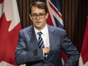 Ontario Labour Minister Monte McNaughton takes to the podium during a news conference in Toronto on Wednesday, April 28, 2021.