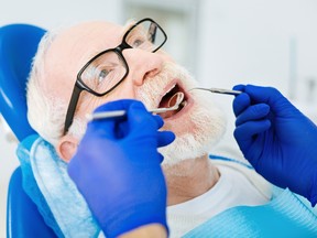 A senior undergoes a dental exam.
