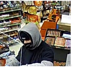 London police are asking for the public's help identifying two suspects, one of whom is shown here, after the robbery of an Oxford Street variety store last week. (London police handout.)