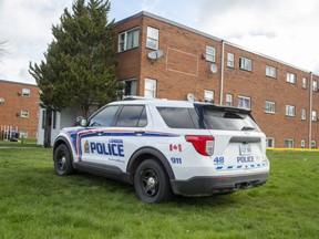 Police were on scene April 22, 2021, the day after a fire at this apartment building on King Edward Avenue in London. (Derek Ruttan/The London Free Press file photo)