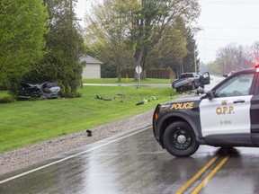 Two people were rushed to hospital following a two-vehicle crash Monday evening at the intersection of Nairn and Oxbow roads near Lobo. (Derek Ruttan/The London Free Press)