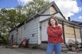 Jacqueline Thompson, executive director of LifeSpin, stands outside a house at 150 Adelaide St. N. where a suspicious fire on May 9, 2021 caused about $100,000 in damage. LifeSpin had warned city hall twice in five months about unsafe conditions inside the house, but no action was taken, Thompson said. (Derek Ruttan/The London Free Press)