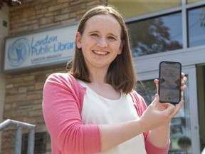 Anne O'Sullivan, manager of customer services and branch operations with the London Public Library, displays an app that people can use to read books on their cellphones. The library is expanding its digital offerings by teaming up with the public libraries in Hamilton, Burlington and Mississauga. (Derek Ruttan/The London Free Press)