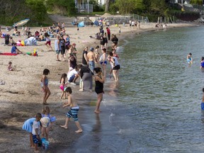 Hundreds of people enjoy Little Beach  in Port Stanley on Sunday. (Derek Ruttan/The London Free Press)