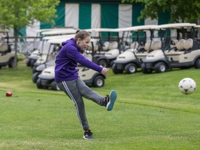 London TFC Academy defender Caitlin McBurney strikes a ball off the first tee of the soccer-golf course at East Park. (Derek Ruttan/The London Free Press)