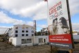 Construction workers frame new luxury apartments by Drewlo Holdings on Adelaide Street just south of Sunningdale Road in London on Nov. 6, 2017 (Free Press file photo)