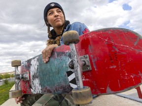 Sophie Grant, of London, poses with her board Monday May 10, 2021. Grant is heading to the Tokyo Olympics this summer as a skateboarder. (Mike Hensen/The London Free Press)