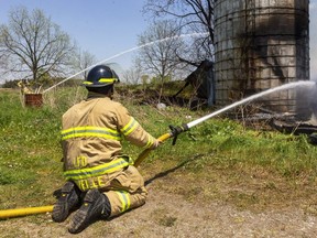 A barn on Colonel Talbot Road, just south of Pack Road caught fire on Tuesday and was a fully engulfed by the time firefighters got on the scene. (Mike Hensen/The London Free Press)