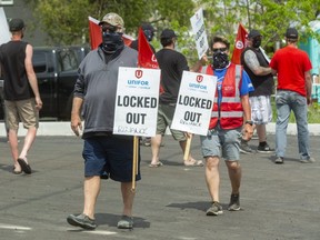 Al Gaiser and Sherry Moss, both service technicians for Reliance Home Comfort, are among about 830 workers locked out by Reliance across Ontario since May 13. A new deal has workers going back to the job as of July 5. (File photo)