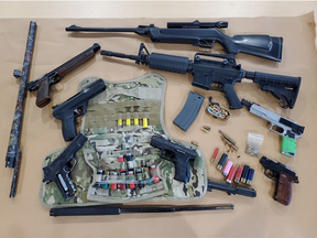 London police seized a pistol, replica firearms, ammunition and a small quantity of drugs in a search of a home on Oxford Street West on April 30. Police are searching for a 48-year-old London man who faces three weapon and drug charges. (London police photo)
