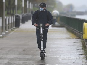 Even on a rainy Monday, May 3, 2021, Windsor residents couldn't resist taking the new rental e-scooters for a spin. Here, Krish Soni takes one for a ride along the riverfront.