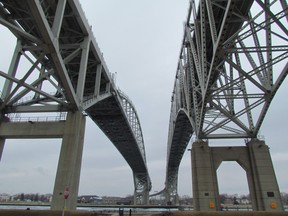 The twin spans of the Blue Water Bridge, near Sarnia, cross the St. Clair River to Port Huron, Mich. (File photo)