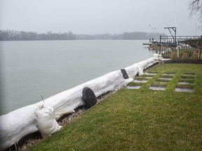 In this April 7, 2020, file photo, sandbags are shown deployed along Riverside Drive East residential waterfront property to help protect against surging river and lake levels. PHOTO BY DAX MELMER /Windsor Star