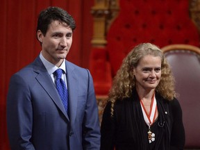 Canada's 29th Governor General, Julie Payette looks on alongside Prime Minister Justin Trudeau in the Senate chamber during her installation ceremony, in Ottawa on Oct. 2, 2017. Canadians are still waiting for the name of her replacement.