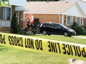 Sarnia police surround a Montrose Street home on Tuesday. Police said people were barricaded inside and urged the public to avoid the area but no other details were immediately available. Terry Bridge/Sarnia Observer