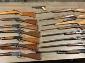 St. Thomas police seized 16 firearms during a search of a residence Sunday. A man is charged with unauthorized possession of a firearm, police said.