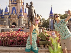 Guests stop to take a selfie at the Magic Kingdom Park at Walt Disney World Resort in Lake Buena Vista, Florida. (Photo by Kent Phillips/Walt Disney World Resort via Getty Images)