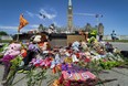 Residential schools memorial of shoes at the Centennial Flame on Parliament Hill , in memory of the 215 children whose remains were found on the grounds of the former Kamloops Indian Residential School in Kamloops, B.C. (Errol McGihon/ Postmedia)