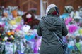 A woman pays her respects at the London Muslim Mosque. (Photo by NICOLE OSBORNE/AFP via Getty Images)