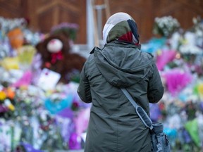 A woman pays her respects at the London Muslim Mosque. (Photo by NICOLE OSBORNE/AFP via Getty Images)
