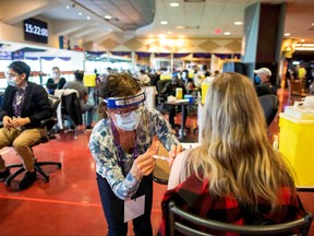 A health-care worker administers the Pfizer/BioNTech coronavirus disease (COVID-19) vaccine, which was authorized by Canada to be used for children aged 12 to 15, at Woodbine Racetrack pop-up vaccine clinic in Toronto May 5, 2021.