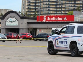 London police on Monday cordoned off a section of the parking lot in Cherryhill Mall, where a man, 20, was arrested following a crash in the city’s northwest end that left four people dead Sunday night. (DALE CARRUTHERS, The London Free Press)