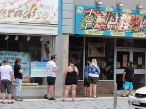 So-called non-essential retail stores in Ontario have reopened with limited capacity. That includes downtown London's popular Heroes comic book store, where customers lined up on Sunday June 13, 2021. (Dale Carruthers/The London Free Press)
