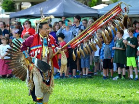 Brian Hill from the London N'Amerind Centre carries the eagle staff during the grand entry of a celebration of Aboriginal Solidarity Day on the Green in Wortley Village on Wednesday June 21, 2017.  (Free Press file photo)