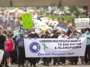 People taking part in a multi-faith march to end racism and Islamophobia head down Hyde Park Road in London. Marchers walked from an intersection on Hyde Park Road where four members of a London Muslim were killed Sunday, in what police said was a targeted attack, to the London Muslim Mosque on Oxford Street.  
Photograph taken on Friday June 11, 2021. 
(Mike Hensen/The London Free Press)