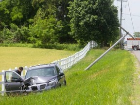 Medway Road between Hyde Park and Wonderland roads was closed by police after a minivan crashed through a utility pole and a driver was arrested. Photo taken Friday June 18, 2021 (Mike Hensen/The London Free Press)