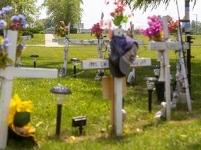 Memorial crosses placed by parents and friends of inmates who died at the Elgin-Middlesex Detention Centre stand on Sholto Drive in London at the entrance to the provincial jail. A grievance board ruled the crosses must be removed because they are having a negative effect on the morale and psychological well-being of staff who drive by them twice a day. (Mike Hensen/The London Free Press)