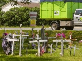 Memorial crosses for inmates who have died at the Elgin-Middlesex Detention Centre stand in a small circle near a driveway leading to the jail on Exeter Road. A grievance board ruled in May that the crosses must be removed by Aug. 3 because they are causing trauma to correctional officers. Mike Hensen/The London Free Press