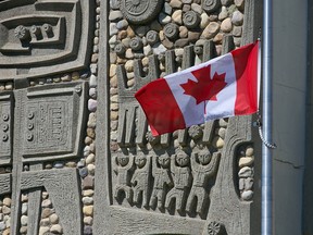 Bishop Grandin High School in Calgary was photographed with its flag at half mast on Tuesday, June. 1, 2021. Gavin Young/Postmedia