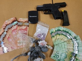 London police seized 170 grams of fentanyl valued at $59,500 and a loaded handgun when they stopped the driver of an SUV on Queens Avenue in downtown London Tuesday. A 25-year-old Toronto man is charged with several drug and weapons offences. (London police photo)