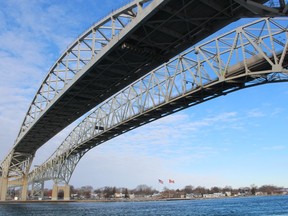The twin spans of the Blue Water Bridge are shown from Point Edward. The Bluewater Bridge Corporation says passenger vehicle traffic was down significantly in 2020 because of pandemic restrictions. Paul Morden/The Observer