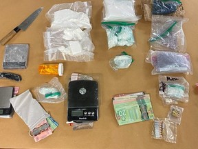 London police seized $234,000 worth of drugs and other items during the search of a home on Oakcrossings Road and a vehicle on Friday, police said. Two men face charges. (London police photo)