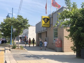 Tourists walk past Lambton OPP headquarters in Grand Bend on Wednesday. The OPP issued a public warning after three alleged incidents involving strangers approaching young children. Terry Bridge/Sarnia Observer/Postmedia Network