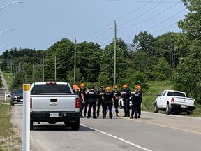London police are shown on the morning of Saturday July 31, 2021 at the scene of a fatal shooting that occurred hours earlier near the intersection of Pack Road and Grand Oak Cross near London's southwestern edge, not far from Byron. An 18-year-old was killed. (Heather River/The London Free Press)