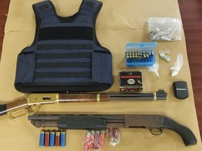A London man faces charges after police seized guns and drugs, shown here, from a Dufferin Avenue home Wednesday, police said. (London police photo)