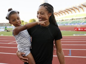 Decorated Olympian Allyson Felix celebrates with her daughter Camryn during the 2020 U.S. Olympic track and field team trials in June in Eugene, Ore. (Steph Chambers/Getty Images)