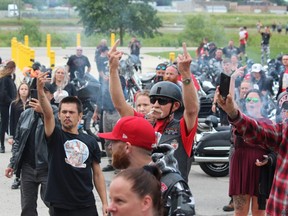 Protesters gesture outside London's provincial jail, the Elgin-Middlesex Detention Centre, on July 17, 2021 to mark the death of inmate Brandon Marchant, 32. (Dale Carruthers/The London Free Press)