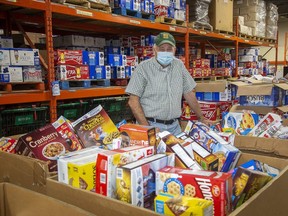 Glen Pearson, co-executive director of the London Food Bank, said the Curb Hunger food drive last month put London on a new path to provide locally grown, nutritious food to families. The equivalent of 38,360 kilograms of food was donated in the 10-day drive. (Derek Ruttan/The London Free Press)