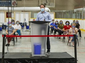 Chris Mackie, medical officer of health at the Middlesex-London Health Unit,  thanks staff at the Oakridge arena COVID-19 assessment centre during a news conference Wednesday, June 30, 2021 to announce the site's last day of operation will be on July 16. (Derek Ruttan/The London Free Press)