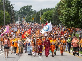 Ten thousand people walk east on Riverside Drive toward Ridout Street during the Turtle Island Healing March in London on Thursday, July 1, 2021. (Derek Ruttan/The London Free Press)