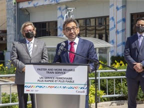 Federal transport minister Omar Alghabra speaks at the Via Rail station in London while flanked by Mayor Ed Holder (left) and London North Centre MP Peter Fragiskatos on Wednesday July 21, 2021. (Derek Ruttan/The London Free Press)