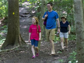 Three generations of the Davies family Alice (7), her father Colin and her grandmother Laurel enjoy a walk in the Medway Valley Heritage Forest. (Derek Ruttan/The London Free Press)