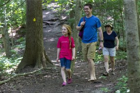 Three generations of the Davies family Alice (7), her father Colin and her grandmother Laurel enjoy a walk in the Medway Valley Heritage Forest. (Derek Ruttan/The London Free Press)