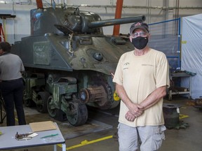James McNeil, one of the technicians working on the restoration of the Holy Roller tank, works on the Victoria Park landmark Thursday July 29, 2021. at Fanshawe College in London. The aim is to have the restored tank back in the park  by June 2022 in time for the 150th anniversary of London's 1st Hussars regiment. (Derek Ruttan/The London Free Press)