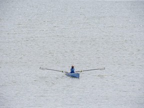 A rower enjoys a quiet Friday morning on Fanshawe Lake. (Derek Ruttan/The London Free Press)